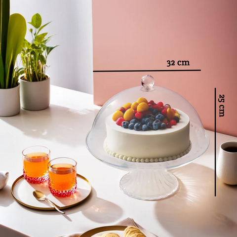 Faye clear acrylic cake stand with dome lid features a clear acrylic stand holding white frosted cake with berries