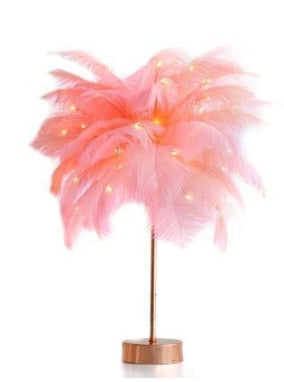 A delicate pink feather lamp with a gold stand for bedroom bedside decor featuring remote control and power supply