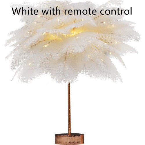 White feather lamp with copper base and stem illuminated by warm led lights perfect for bedside use with remote control and power supply