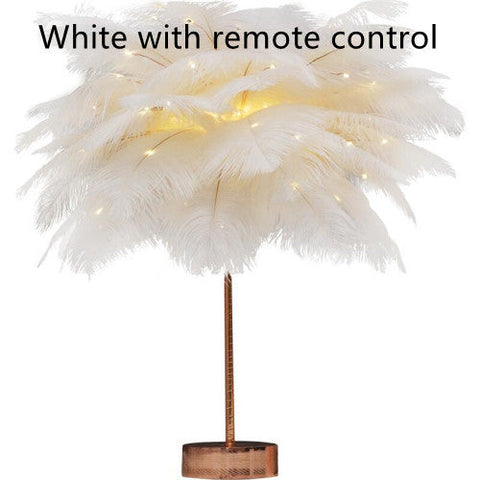 White feather lamp with copper base and stem illuminated by warm led lights perfect for bedside use with remote control and power supply