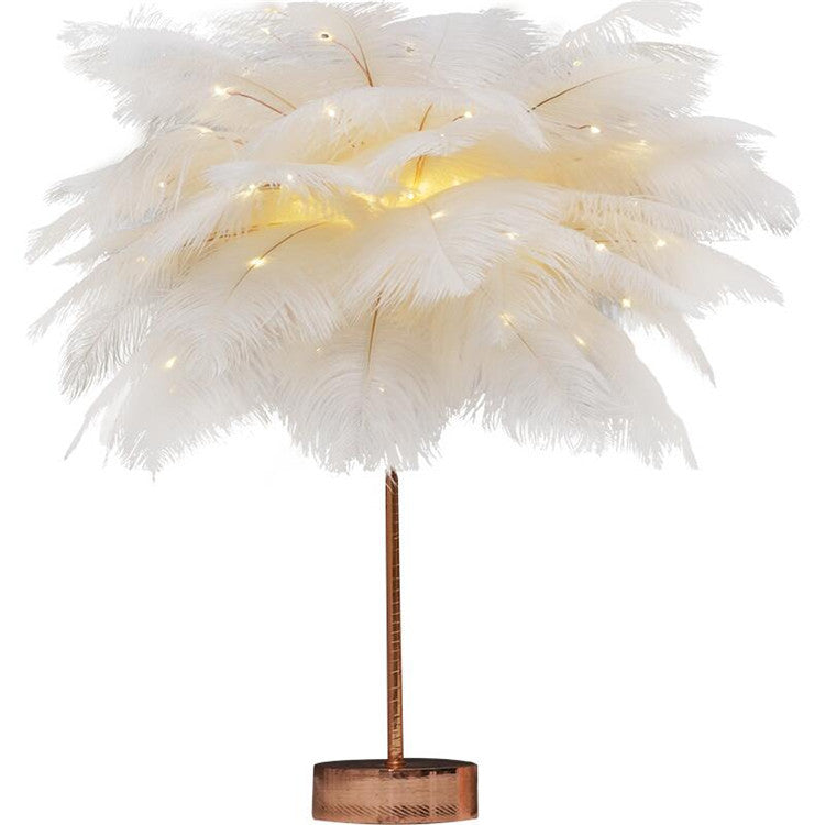 A white feather lamp with copper base and warm led lights perfect for bedside decoration with remote control power supply