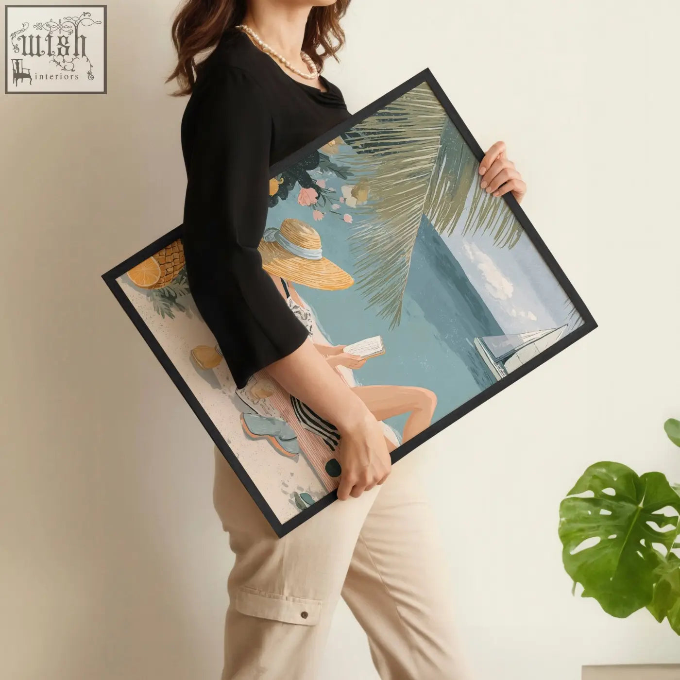 Black-framed wall art of a woman in a straw hat reading by the seaside with pastel colors for italian lifestyle wall