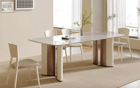 Felicia marble dining table with a sleek glossy white marble top and beige cylindrical legs for modern dining
