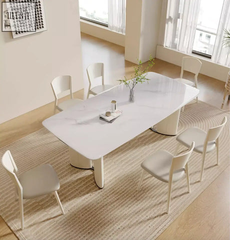 Modern white marble dining table with sleek curved legs and minimalist design perfect for felicia marble dining use