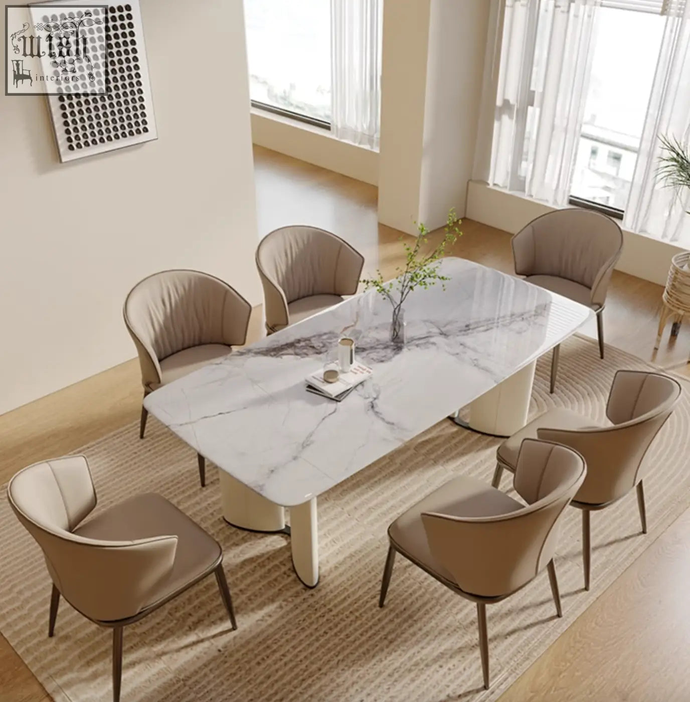 Felicia marble dining table with modern white marble top and sleek cylindrical legs surrounded by six beige chairs