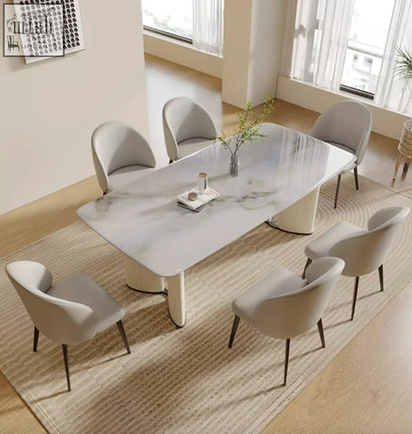 Modern white marble dining table felicia marble dining with sleek curved legs and minimalist design