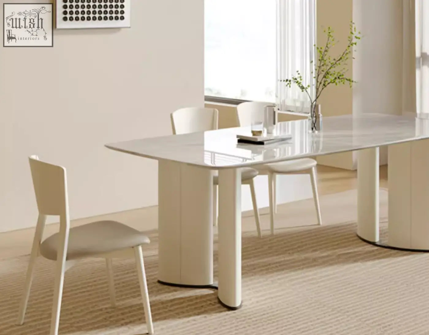 Modern felicia marble dining table with white marble top and sleek cylindrical legs for stylish dining space