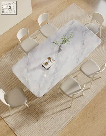 Felicia marble dining table with a sleek rectangular white marble surface and subtle gray veining perfect for dining