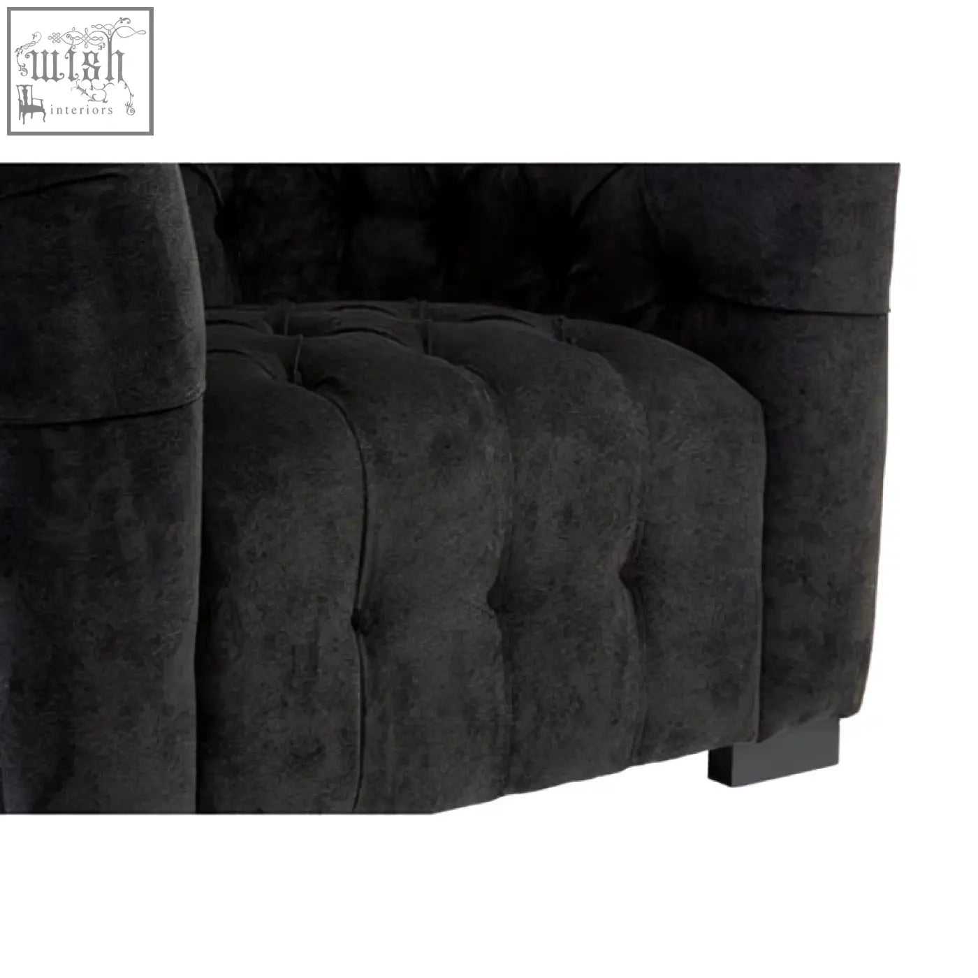 Fenton black fabric armchair in black tufted velvet with plush textured fabric and classic button detailing