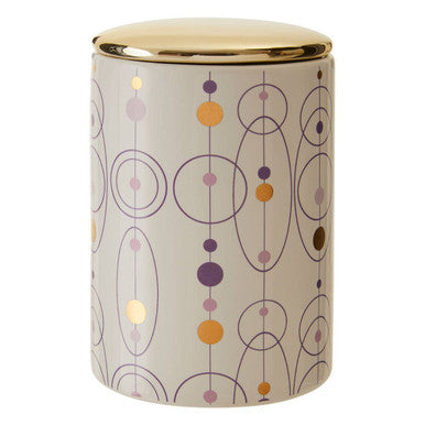 A fenwick canister ceramic with a gold finish lid and abstract geometric circles in muted orange purple yellow and gray