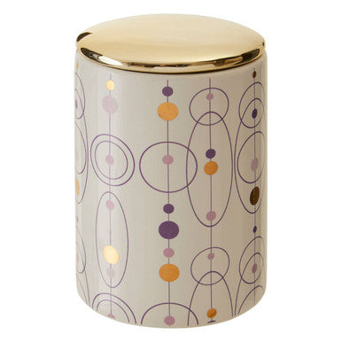 A fenwick canister with a sleek ceramic body and gold finish lid featuring an abstract geometric pattern in muted colors