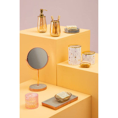Gold-toned pump soap dispenser with sleek cylindrical body and reflective surface featuring gold finish lid fenwick canister