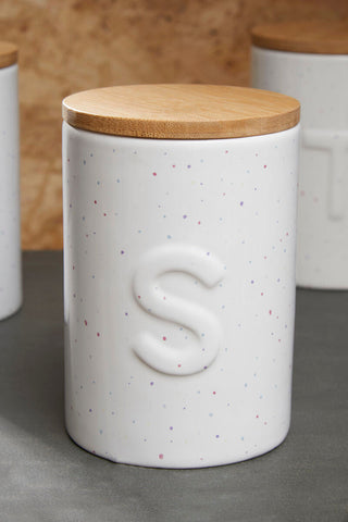 White ceramic fenwick sugar canister with speckled finish wooden lid and embossed letter s perfect for choose orsina