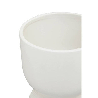 White ceramic fia white planter with smooth rounded edges and a minimalist design perfect for indoor plants