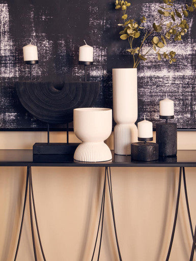 Cream-colored ceramic fia white planter with fluted rounded body and slightly wider base perfect as a white planter