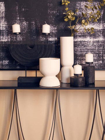 Cream-colored ceramic fia white planter with fluted rounded body and slightly wider base perfect as a white planter