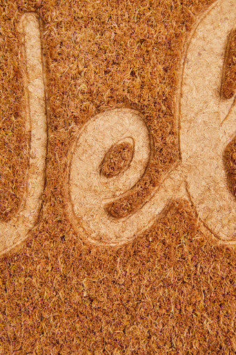 Brown filta coir doormat with embossed beige welcome lettering made from durable coir fibers for outdoor use