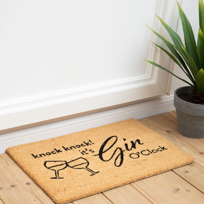 Beige coir gin o’clock doormat by filta gin with black text and wine glasses saying knock knock it’s gin o’clock
