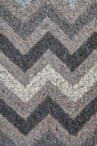 Filta grey and white chevron coir doormat with gray beige chevron pattern and textured plush surface