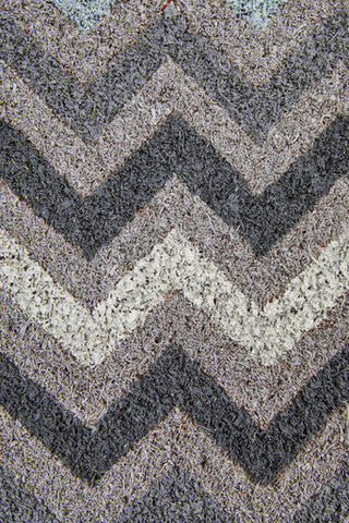 Filta grey and white chevron coir doormat with gray beige chevron pattern and textured plush surface