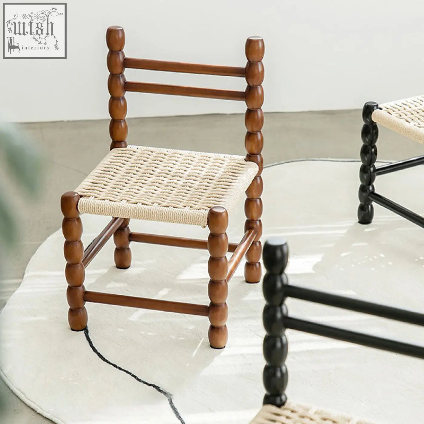 Rustic fiona dining chair with a woven beige rattan seat and spindle legs perfect for dining room use