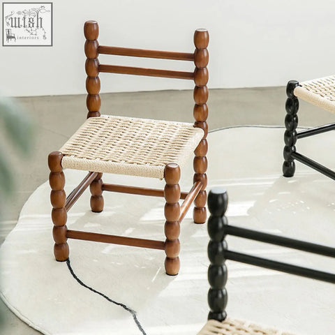 Rustic fiona dining chair with a woven beige rattan seat and spindle legs perfect for dining room use