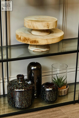 Natural wood cake stand with rustic circular design and visible grain on natural stone base for small succulents