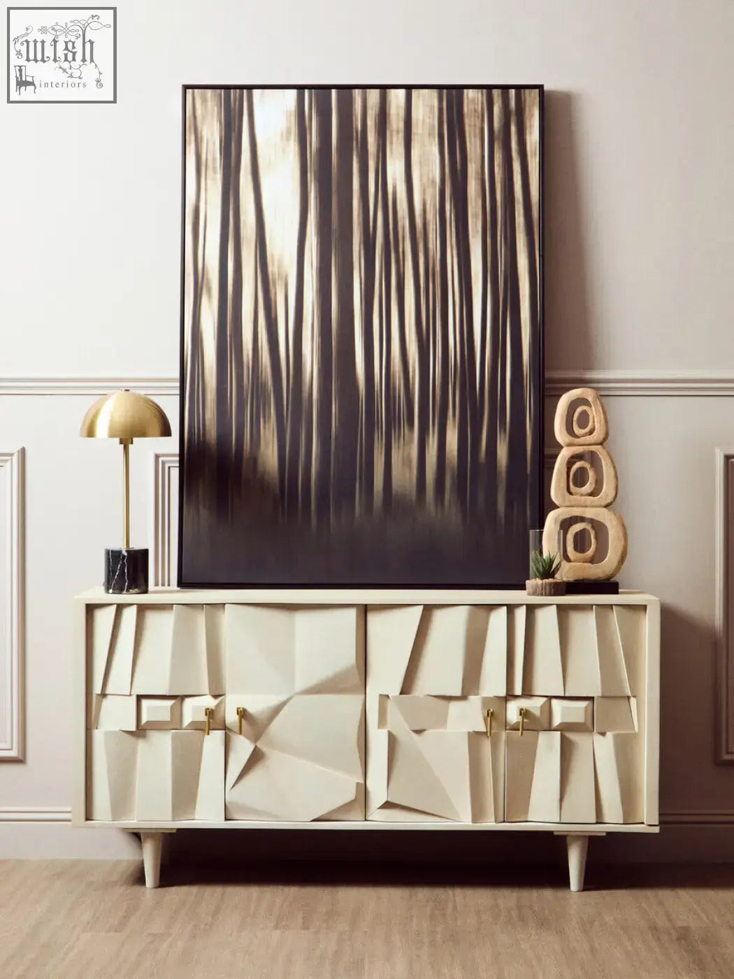 Cream-colored geometric sideboard with gold-tone hardware and stone base featuring sculpted angular panels