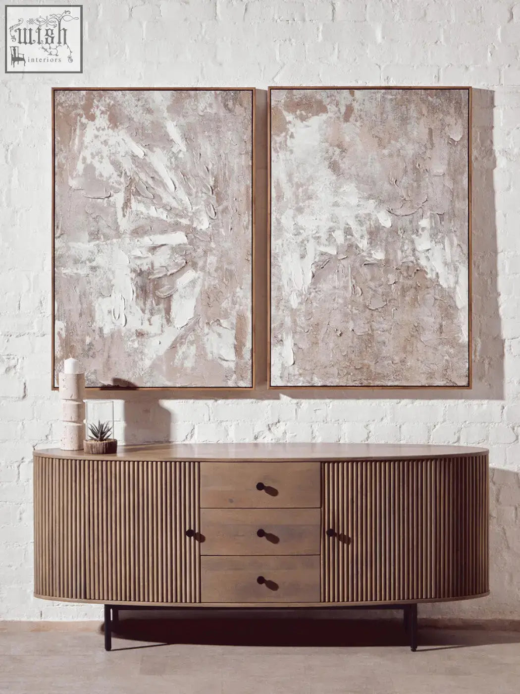 Modern wooden sideboard with vertical slats and dark metal legs next to fiori small succulent with natural stone base