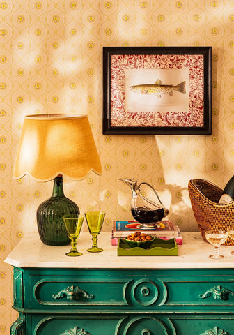 Green ribbed glass lamp with warm yellow fabric shade featured in fish ii framed print a quiet classic with personality