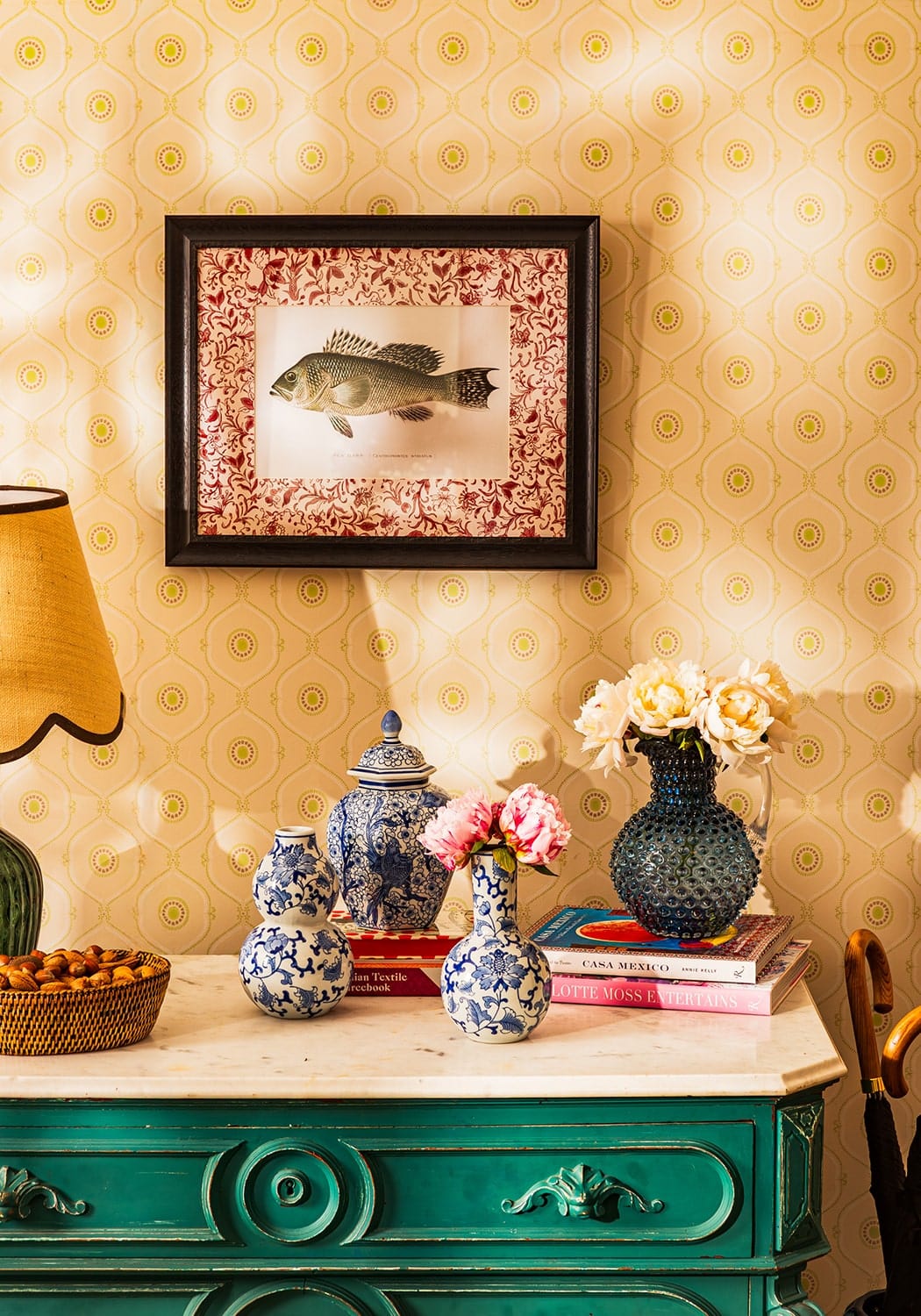 Blue and white porcelain vases with intricate floral patterns on a green dresser in fish iii framed print noble vintage