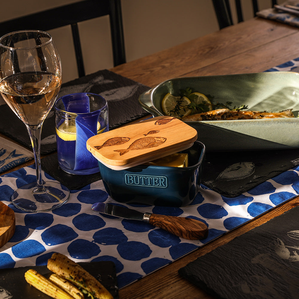 Blue ceramic butter dish with wooden lid engraved with fish designs from the fish repeat collection
