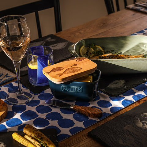 Blue ceramic butter dish with wooden lid engraved with fish designs from the fish repeat collection