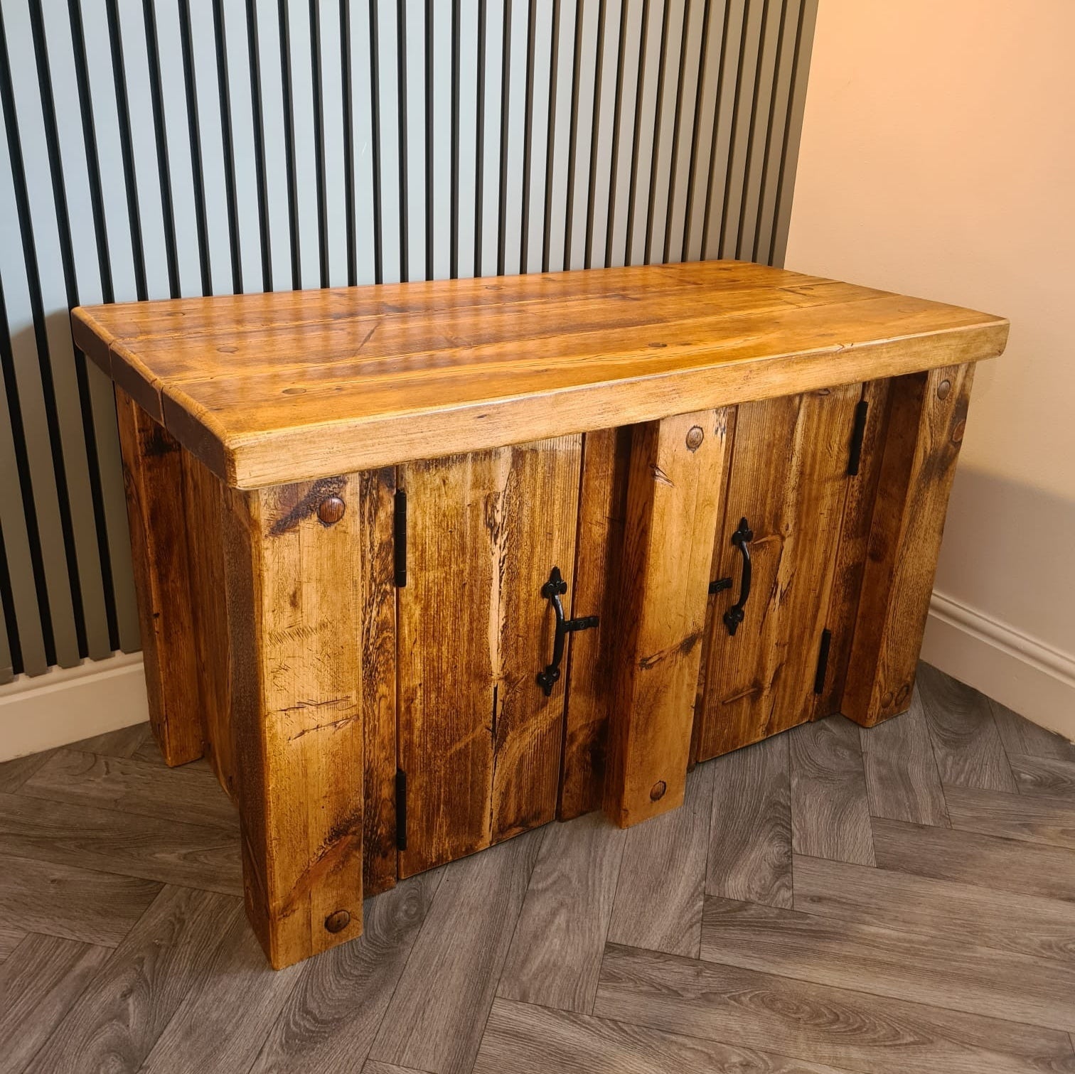 Rustic wooden fish tank stand with warm natural finish and black metal handles for redwood aquarium storage unit