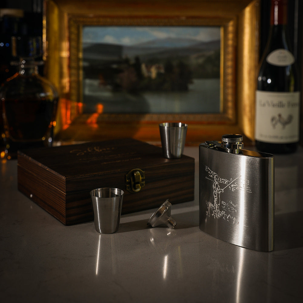 Silver hip flask with engraved figure in motion textured cap sleek metal finish from selbrae house cup set