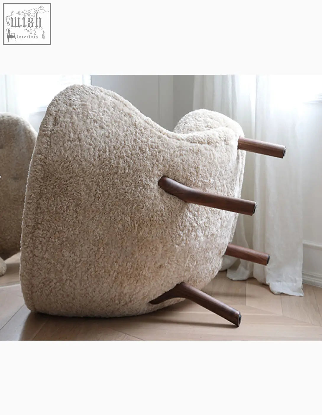 Cream-colored fitz armchair lounge chair with long hair artificial wool and dark wood legs