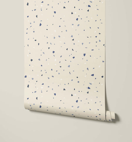 Beige terrazzo-patterned wallpaper flake with navy blue and gray specks for stylish interior walls