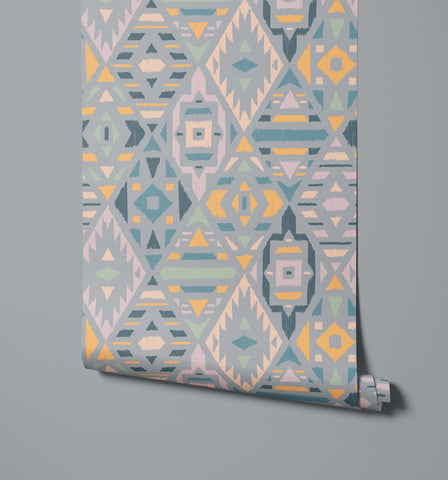 Fleece fabric with geometric pattern in muted gray teal yellow and beige tones featuring a textured brushstroke finish
