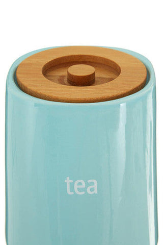 Fletcher blue ceramic tea canister with natural wood lid and white tea print on light blue ceramic tea container