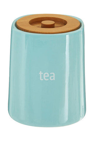 A sleek light blue ceramic tea canister with natural wood lid and tea print from fletcher blue ceramic tea series