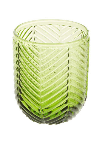 A translucent lime green glass tumbler with a chevron texture from the fleur set of four green tumblers