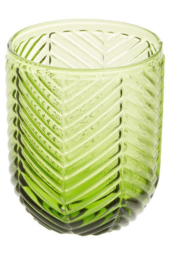 A translucent lime green glass candle holder with a textured chevron pattern from the fleur set of four green tumblers