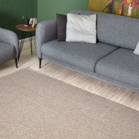 Beige low pile flex beige low textured area rug with a subtle woven pattern perfect for any room