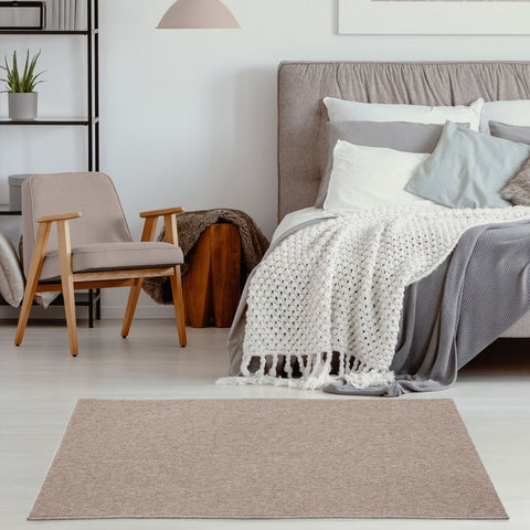 Beige low pile area rug with subtle woven pattern perfect for flexible living spaces and modern decor