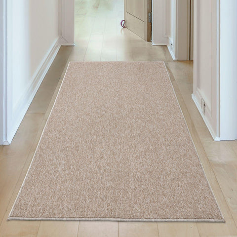 Beige low pile flex beige low textured runner rug with subtle woven pattern and neatly finished edges