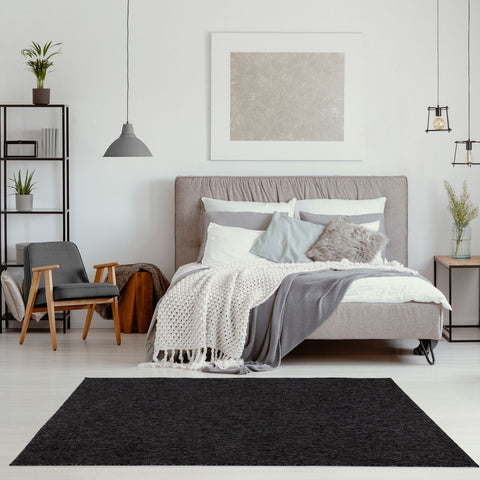 Black textured low pile area rug in flex dark grey perfect for modern living spaces
