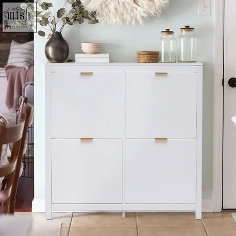 White wood shoe cabinet with four flip down drawers and gold-tone handles holds up to sixteen pairs of shoes