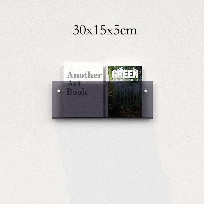 Dark gray translucent floating acrylic magazine holder mounted on wall holding two books in acrylic magazine holder style