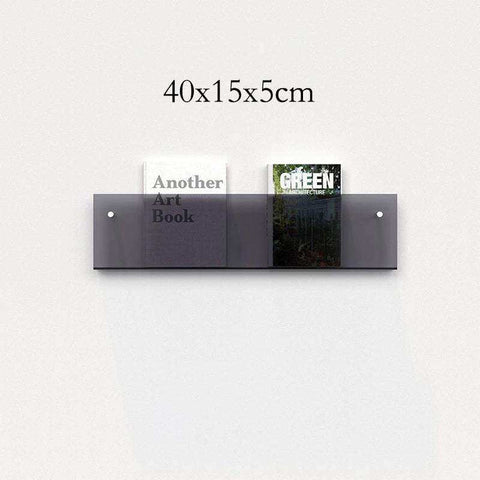 A sleek translucent dark gray floating acrylic magazine holder with two compartments for wall mounting