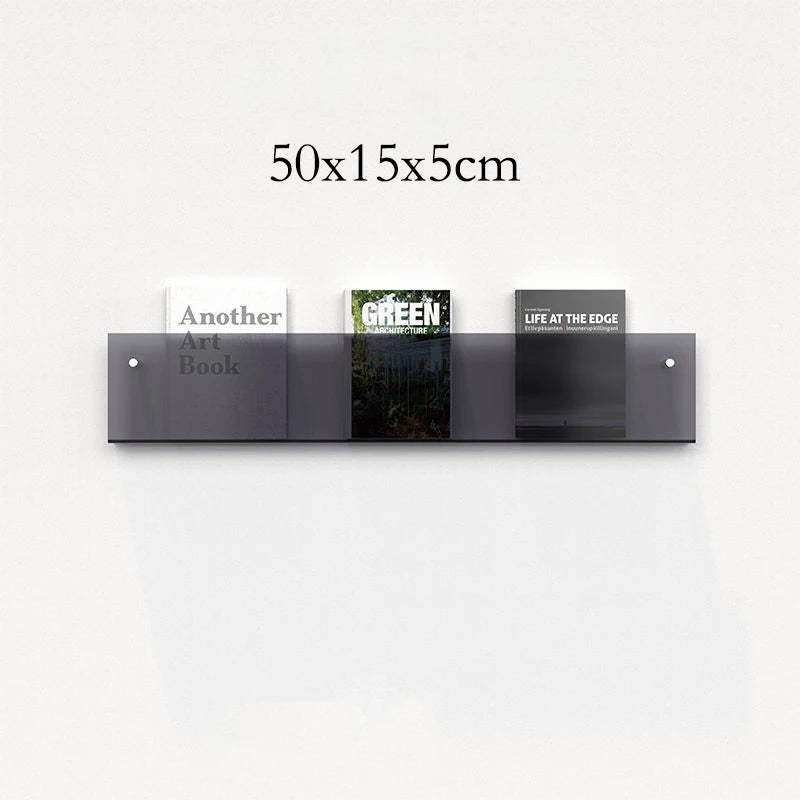 Modern minimalist floating acrylic magazine holder with three gray transparent acrylic compartments holding books